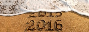 2015 2016 written into sand with wave washing away written 2015